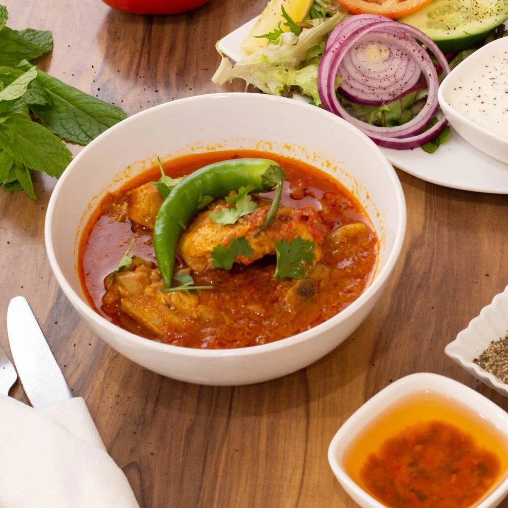 Savory and delicious chicken curry with spices and vegetables. Special Afghan cuisine.