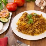 Spicy and flavorful chicken biryani with rice and herbs. A favourite Afghan cuisine.